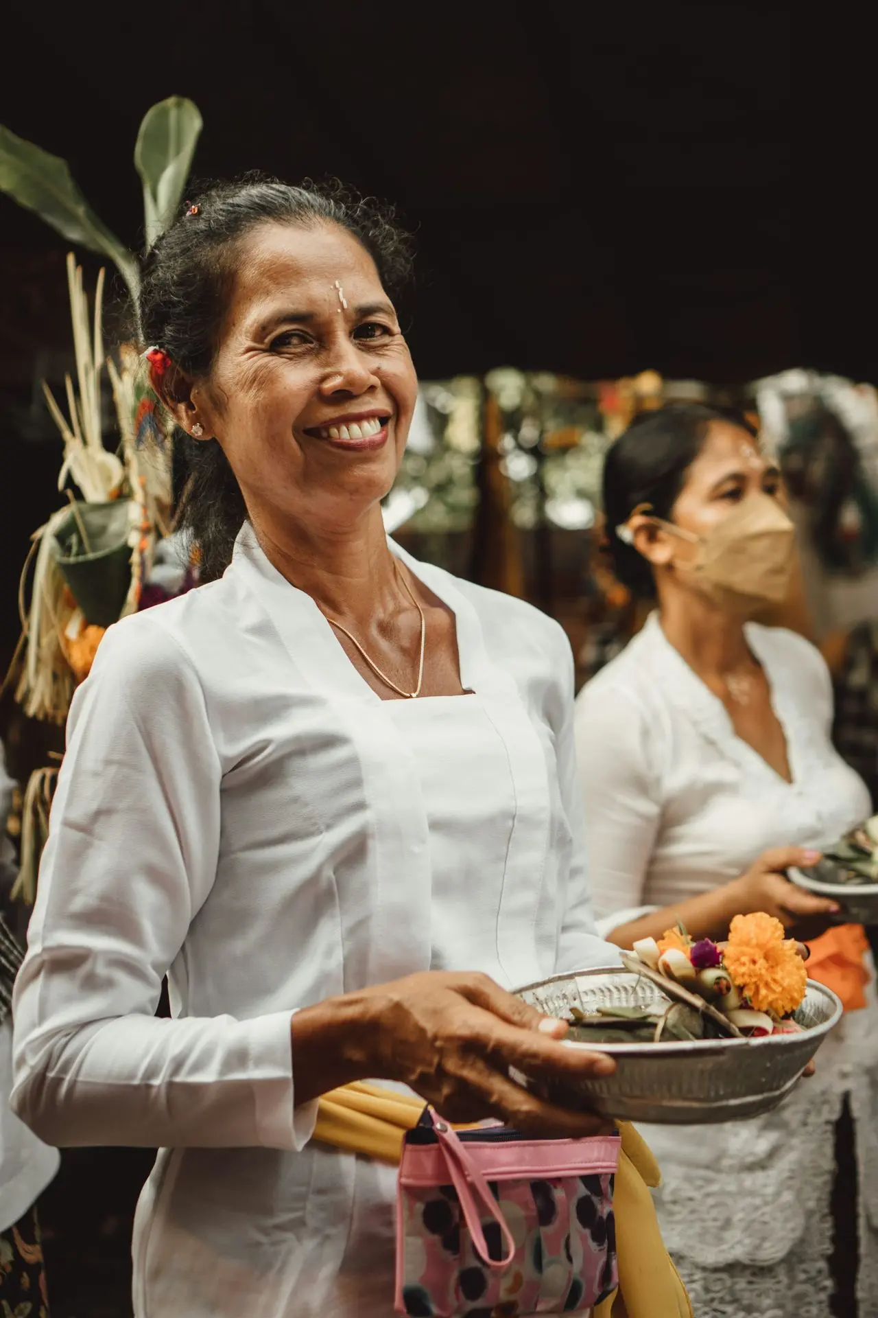 a person holding a plate of food